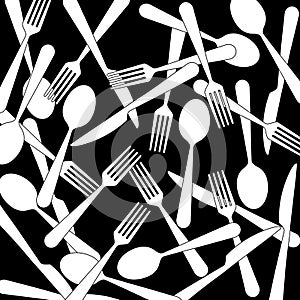 Many knives, forks and spoons lying mixed up