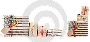 Many Kraft stylish christmas gift boxes isolated on white background