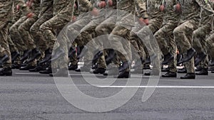 Many legs go in a row. Military uniform. A company of soldiers marching in a parade. Soldier boots. Pixel shape