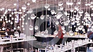 Many light bulbs hang from the ceiling