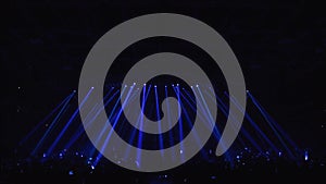 Many lighting devices on the empty stage of the concert hall. Stock footage. Blue and purple shimmering light strobes