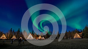 Many lightup Tipi with Aurora Borealis at Yellow Knife