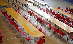 many long table with chairs in a wide lunch room