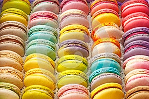 Many macaroon cookies with different tastes in a box photo