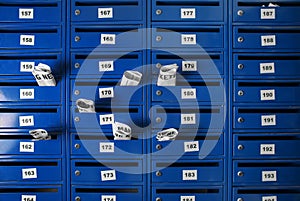 Many mailboxes with newspapers indoors