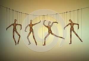 Many marionette in different positions hanging on the threats, manipulate the people concept,