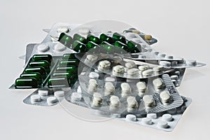 Many medicine pills and tablets. Colorful capsules and tablets closeup.