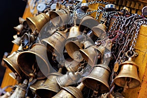 Many metal sacrificial bells photo
