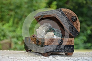 Many minerals quartz and crystal stones in wooden box