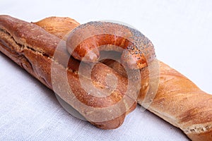 Many mixed breads and muffins on white background.