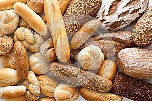 Many mixed breads and rolls.