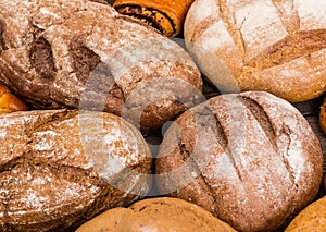 Many mixed breads and rolls shot from above photo