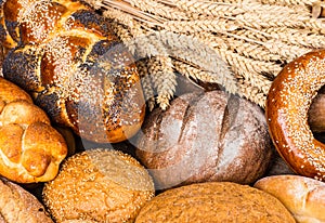 Many mixed breads and rolls shot from above photo