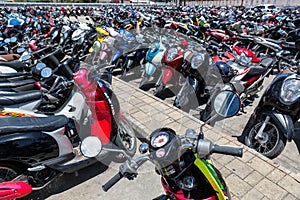 Many motorbikes at the parking photo