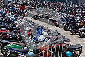 Many motorbikes at the parking photo