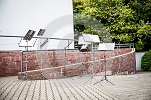 Many music stands for an orchestra in the open air