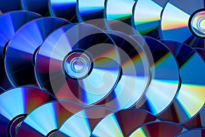 Many musical compact discs with a rainbow spectrum of colors as