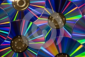 Many musical compact discs with a rainbow spectrum of colors as