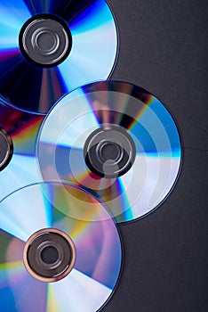 Many musical compact discs with a rainbow spectrum of colors as