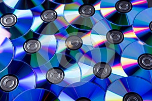 Many musical compact discs with a rainbow spectrum of colors as