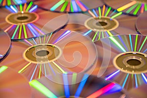 Many musical compact discs with a rainbow spectrum of colors as