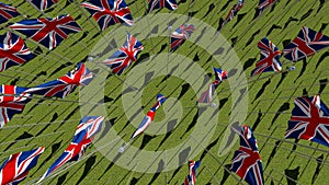 Many national flags of the United Kingdom in green field.