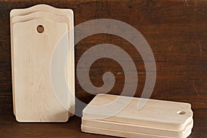 Many new cutting boards of a birch tree on antique wood background