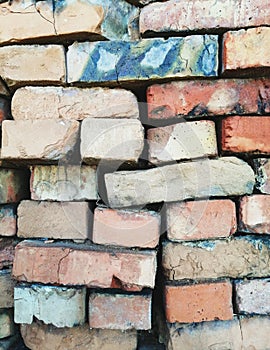 Many old colored bricks, closeup.