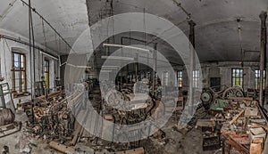 many old machines in abandoned factory panorama