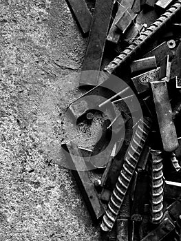 Many old steel on dirty ground in black and white photography