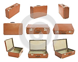Many Old Suitcases on white