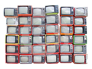 Many old vintage televisions pile up isolated on white background with clipping path