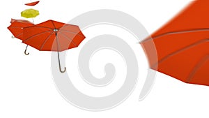 Many orange umbrellas with red yellow parasols flying in the air with the wind