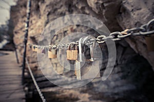 Many padlocks on a chain