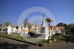 Many pagodas with beep blue sky at Wat-Chedi-Sao-Lang, Lampang photo