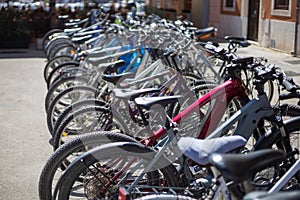 many parked bicycles in the town