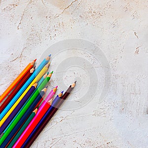Many Pecils of different bright colors in diagonal line on cement grey background, Kid, Children, Education, Copy space, Triangle