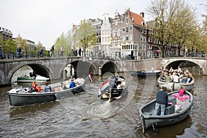 Many people on canal trip in centre of dutch capital amsterdam