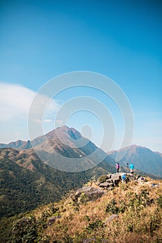 Many people hiking on the path to the famos location, Sunset Peak, Lantau Island, Hong Kong