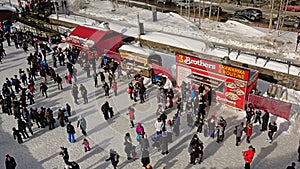 Many people ice skating on rideau canal skateway during the winterlude festival in Ottawa