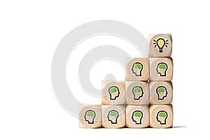 Many people together having an idea symbolized by icons on cubes