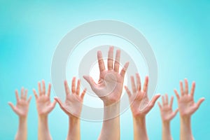 Many people women hands raising up showing vote, volunteer participation, rights equality concept photo