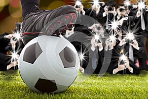 Many photographer taking winner soccer player feet