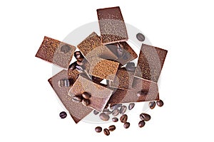 Many pieces of broken bar dark bitter or milky chocolate and fried coffee beans sprinkled of powder cocoa isolated on white