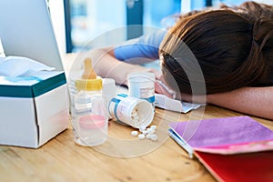 So many pills but the pain just wont stop. Cropped shot of a young woman feeling unwell at home.