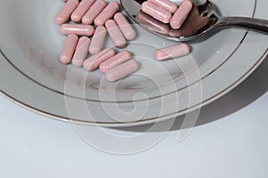 Pink pills in the plate