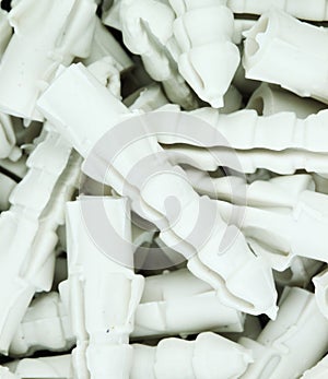 Many plastic straddling dowel