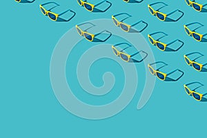 Many plastic sunglasses on turquoise blue background with copy space