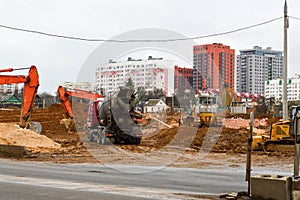 Many powerful industrial heavy specialized construction equipment of tractor excavators and bulldozers make road repairs