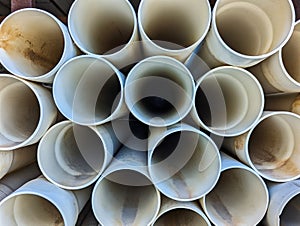 Many PVA Pipes Stacked in Building Supply Warehouse